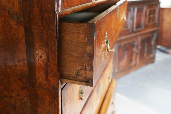 TooveysA George I and later burr walnut chest-on-stand with overall feather