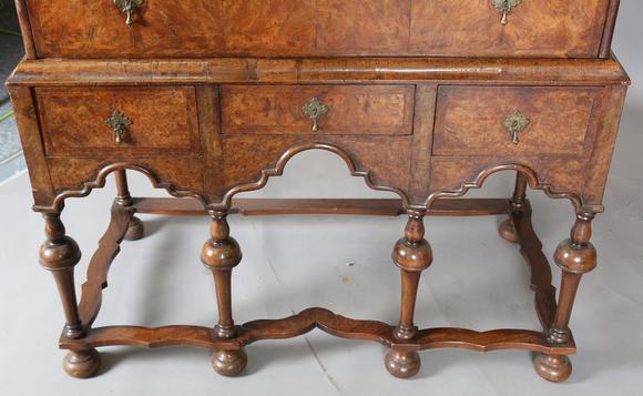 TooveysA George I and later burr walnut chest-on-stand with overall feather