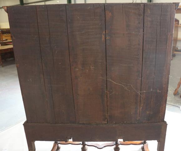 TooveysA George I and later burr walnut chest-on-stand with overall feather