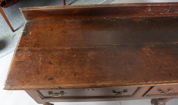 TooveysAn 18th century provincial oak dresser base, fitted with three drawe
