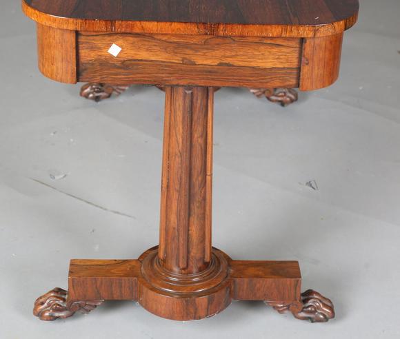 TooveysAn early Victorian rosewood centre table, fitted with two frieze dra