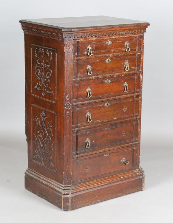 TooveysA late Victorian Aesthetic Movement stained oak chest of six drawers