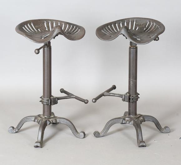TooveysA pair of late 20th century cast iron bar stools with reproduction J
