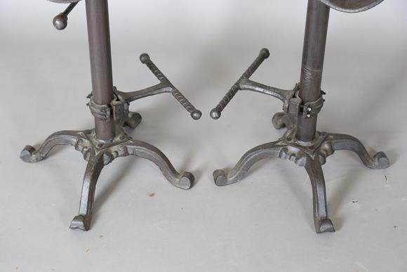 TooveysA pair of late 20th century cast iron bar stools with reproduction J