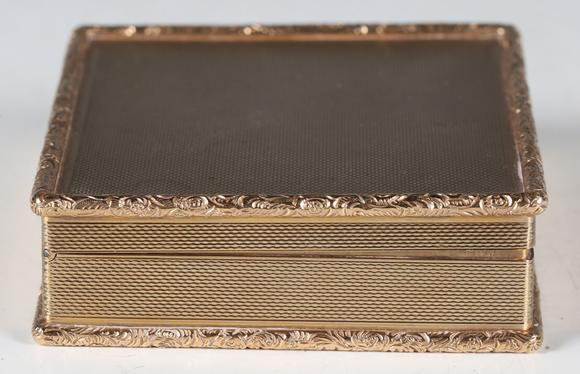 TooveysA mid-20th century 9ct gold rectangular box with overall machine eng