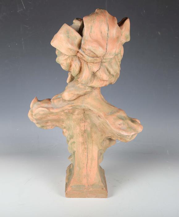 TooveysA modern cast composition head and shoulders portrait bust of a youn