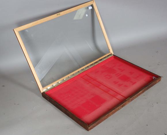 TooveysA 20th century glazed shallow display case with hinged front, height