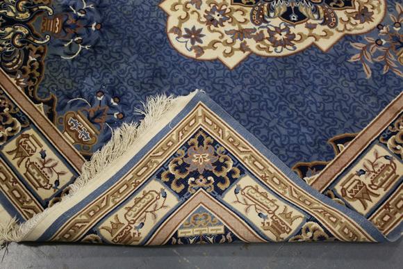 TooveysA Chinese carpet, late 20th century, the blue field with a floral me