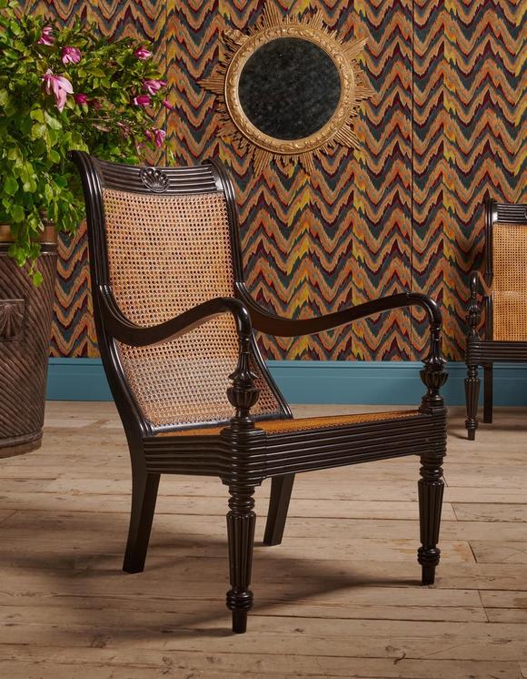DreweattsY A CLOSELY MATCHED PAIR OF CEYLONESE CARVED EBONY ARMCHAIRS, FIRST HALD 19TH CENTURY