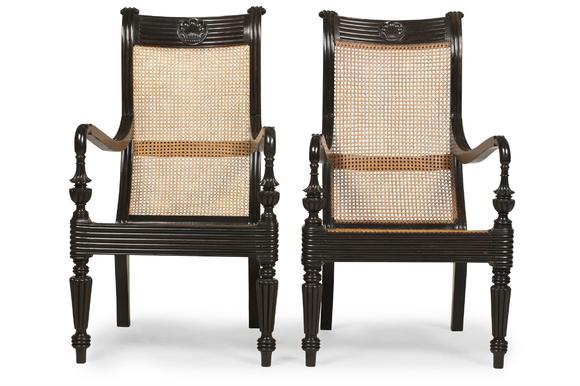DreweattsY A CLOSELY MATCHED PAIR OF CEYLONESE CARVED EBONY ARMCHAIRS, FIRST HALD 19TH CENTURY