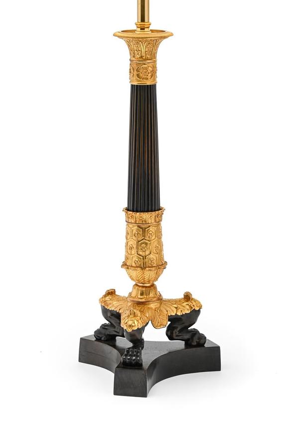 DreweattsA PAIR OF GILT AND PATINATED BRONZE CANDLESTICK TABLE LIGHTS, EARLY 19TH CENTURY