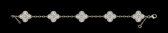 Piguet - H?tel des VentesVan Cleef & Arpels, Alhambra, bracelet en or gris 750 orné de 5 motifs sertis de diamants taille brillant