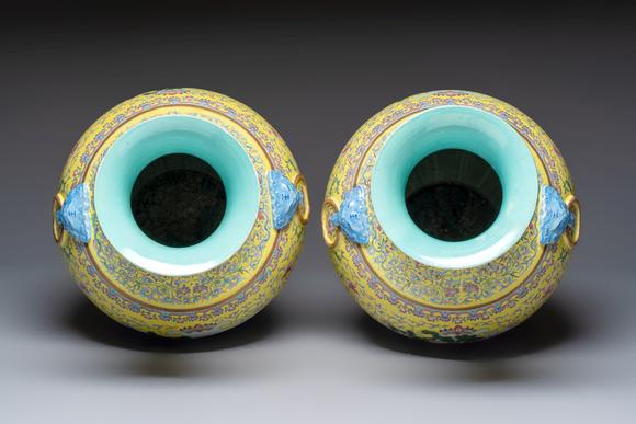 Rob Michiels AuctionsA pair of large Chinese famille rose yellow-ground 'Hu' vases with narrative design, Qianlong mark, Republic