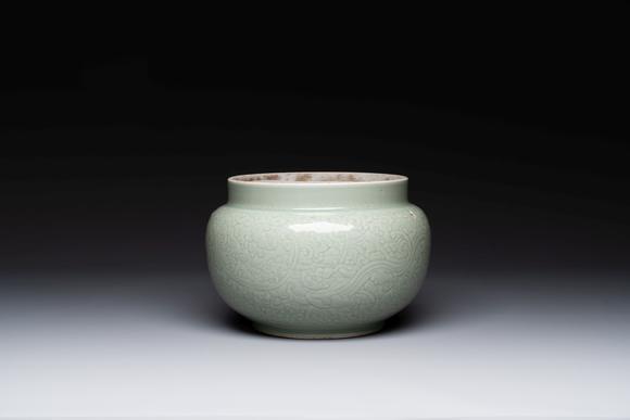 Rob Michiels AuctionsA Chinese celadon-glazed bowl with incised chilong among floral scrolls, Kangxi