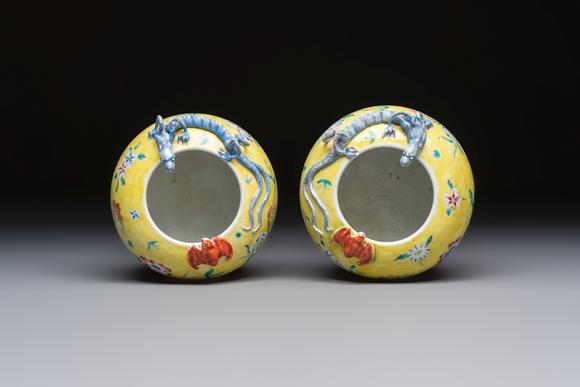 Rob Michiels AuctionsA pair of Chinese famille rose yellow-ground water pots with floral design and applied chilong and bats, Qianlong mark, 19/20th C.