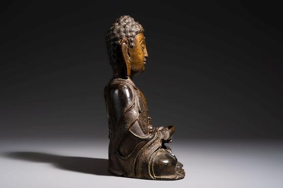 Rob Michiels AuctionsA Chinese bronze seated Buddha, Ming