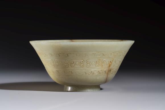 Rob Michiels AuctionsA Tibetan ritual jade bowl with a red coral-mounted silver cover and a stand, 19th C.