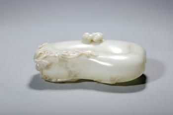 A White Jade Gourd-Shaped Brush Washer Carved with Monkey and Vine, China, 14th–17th centuries