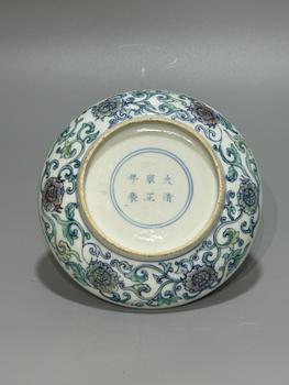 A Doucai Circular Dish with Central Intertwined Floral Scroll Medallion, Double Blue Line Border, China, 18th century