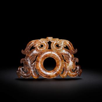 Han Hetian jade carving with dragon and phoenix patterns. | 漢 和田玉透雕龍鳳紋璧形佩