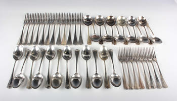 A George VI part canteen of silver Hanoverian with Rat Tail pattern cutlery, comprising twelve table forks, eight dessert forks, twelve dessert spoons