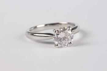 A platinum and diamond single stone ring, claw set with a circular cut diamond, weight 5.1g, diamond weight approx 1.43ct, ring size approx M, with a
