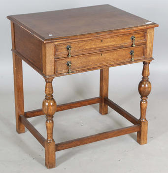 A George V oak two-drawer side table, height 77cm, width 71cm, depth 56cm.