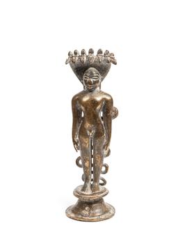 A BRASS SCULPTURE OF JINA PARSVANATHA, India, 16th century