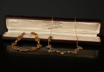 A gold necklace and a bracelet, Art Nouveau…