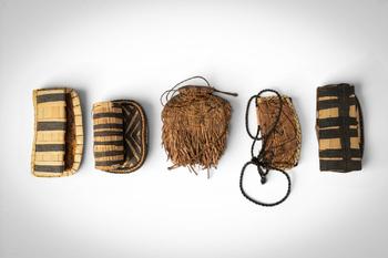 Ca. 20th century AD. >
A group comprising five negbe, each incised with linear and abstract motif