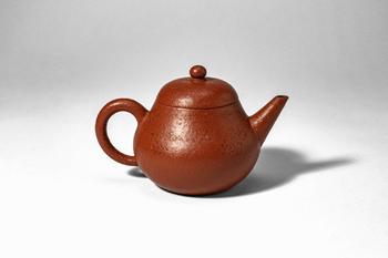 Qing Dynasty, Ca. AD 1644 - 1912. >
A teapot of rounded, compressed globular form, raised on a sh