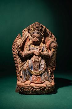 Ca. 17th century AD. >
A carved wooden figure depicting the goddess Varahi, shown seated frontall