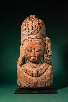 Ca. 16th century AD, or earlier. >
A finely carved wooden mask depicting a bodhisattva, rendered
