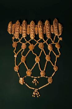 Ca. 16th - 17th century AD. >
An elaborate ritual bone apron composed of intricately carved plaqu