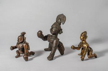 Ca. 12th-19th century AD. A group of three bronze figures of Krishna as the Butter Thief, each de