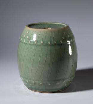 A drum-shaped celadon-glazed ceramic vase. China, 20th century.