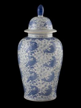 Large porcelain vase with a lid decorated with a carp motif on a plant background. China. 20th century.
