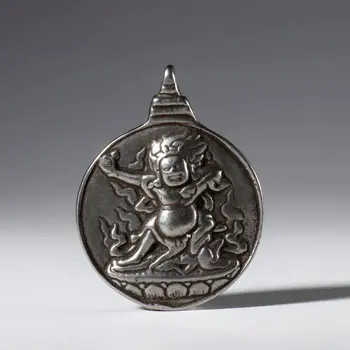 Jiu Gong Ba Gua amulet, made of silver alloy with a depiction of Mahakala. Tibet, 20th century