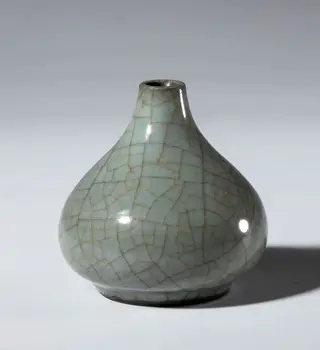 A small, craquelure-glazed celadon ceramic vase. China, 20th century.