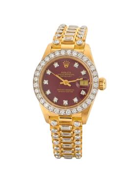 Rolex. An 18ct gold and diamond set bracelet watch with burgundy dia
