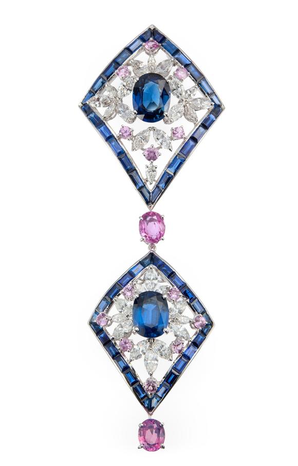 RoseberysA sapphire, diamond and pink sapphire pendant, composed of two lozenge shaped cluster panels, each panel with central single oval mixed-cut sapphire i
