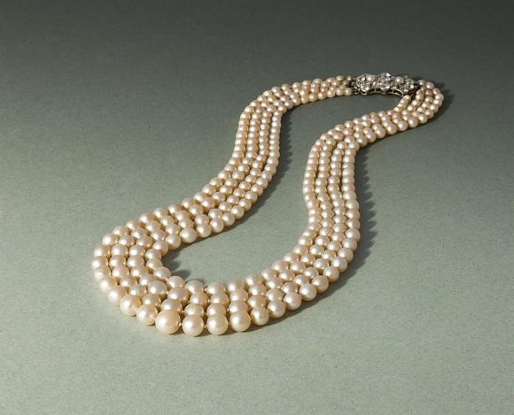 DreweattsAN EARLY 20TH CENTURY FOUR ROW NATURAL PEARL AND DIAMOND NECKLACE