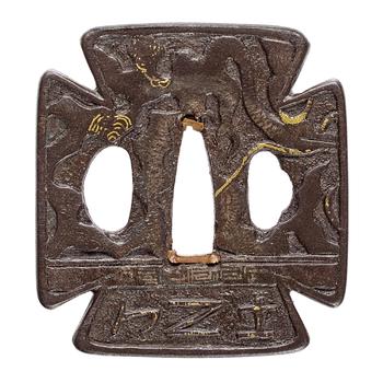 An iron tsuba. probably Hizen province. 17/18th century