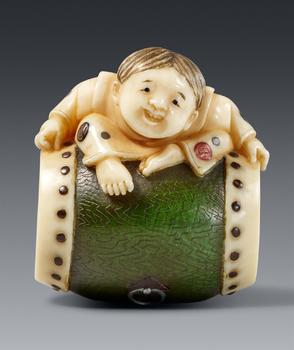 A partly stained netsuke of a boy by Kodama Yoshiaki. Late 19th century