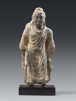 A Gandharan grey shist fragment of Buddha Shakyamuni. Pakistan. Kushan period, around 3rd century