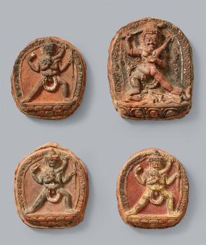 A set of four rare and large terracotta and polychrome tsa-tsa. Western Tibet. 11/12th century