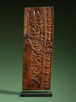A fragment of a large and particularly rare Tibetan wooden aureole. 12–14th century