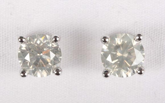 Tooveys|中西方古董藝術專場A pair of platinum and diamond single stone earstuds, each claw set