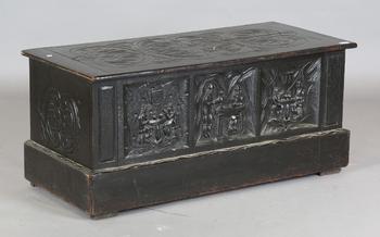A late Victorian oak coffer with carved figural scenes to front, hei