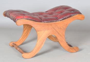A 20th century mahogany ‘X’ framed stool, upholstered in buttoned